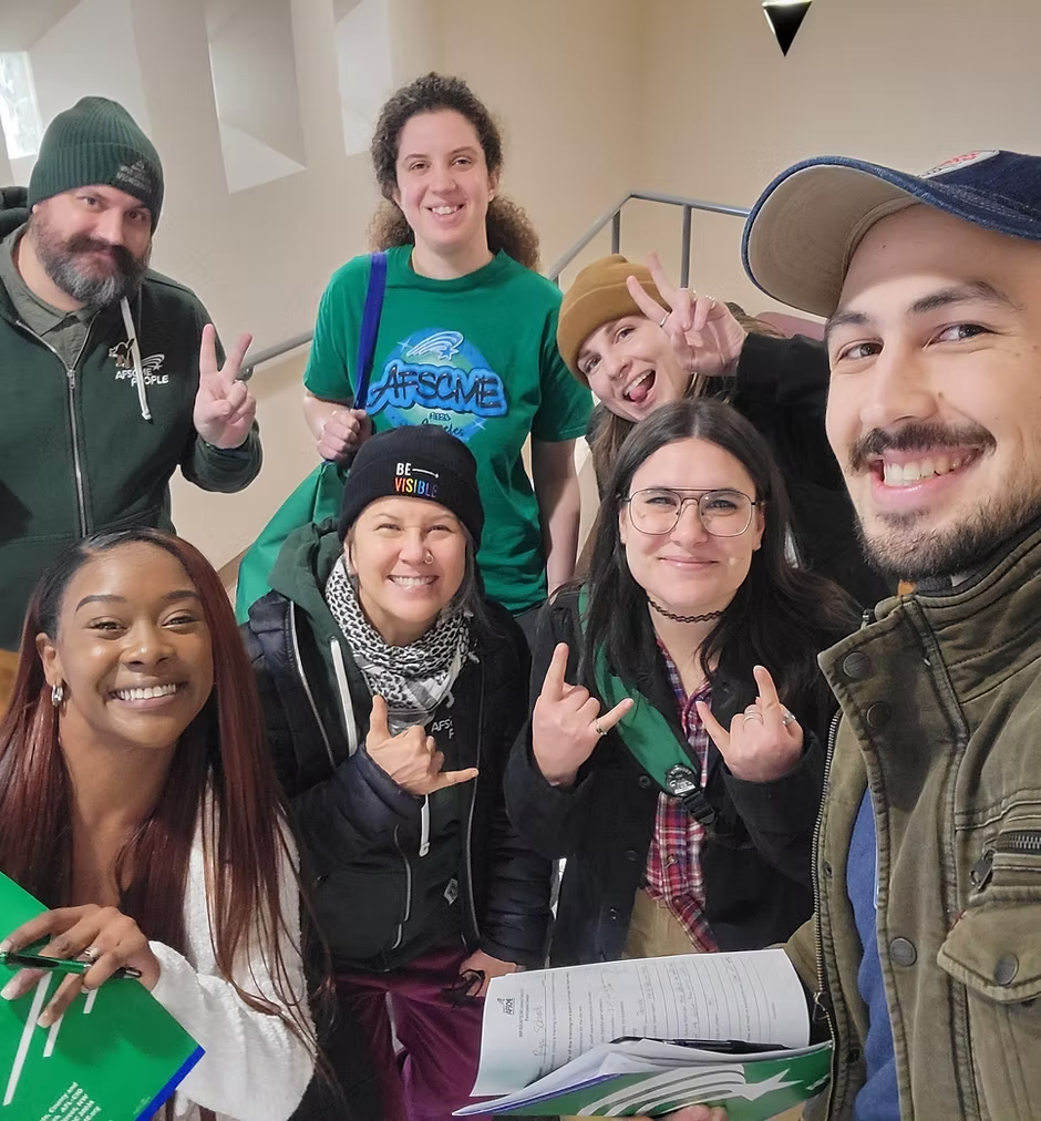 A group of union members smiling
